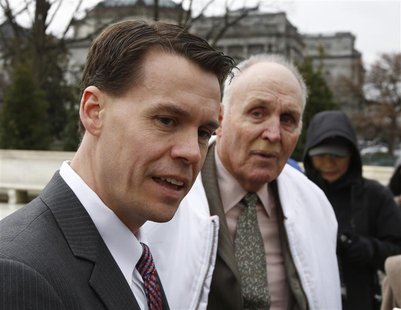 Mark Walters (L), attorney for Indiana soybean farmer Vernon Bowman (R), speaks to the media outside the Supreme Court in Washington, Februa Mark Walters (L), attorney for Indiana soybean farmer Vernon Bowman (R), speaks to the media outside the Supreme Court in Washington, Februa