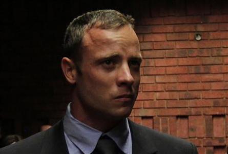''Blade Runner'' Oscar Pistorius awaits the start of court proceedings in the Pretoria Magistrates court February 19, 2013. Pistorius, a double amputee who became one of the biggest names in world athletics, was applying for bail after being charged in court with shooting dead his girlfriend, 30-year-old model Reeva Steenkamp, in his Pretoria house.
Credit: Reuters/Siphiwe Sibeko