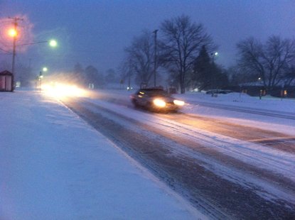 Vehicles navigate a snow covered West Main Street in Kalamazoo on February 19th, 2013. Vehicles navigate a snow covered West Main Street in Kalamazoo on February 19th, 2013.