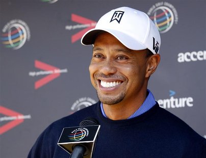 Tiger Woods of the U.S. laughs during a news conference before a practice round for the WGC-Accenture Match Play Championship golf tournamen Tiger Woods of the U.S. laughs during a news conference before a practice round for the WGC-Accenture Match Play Championship golf tournamen