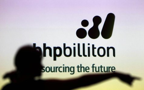 A woman gestures in front of a BHP Billiton sign during a half-year results briefing in Sydney in this February 16, 2011 file photo. REUTERS A woman gestures in front of a BHP Billiton sign during a half-year results briefing in Sydney in this February 16, 2011 file photo. REUTERS