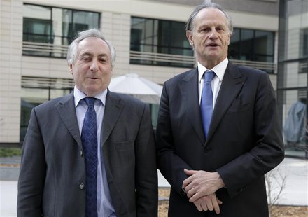 Credit Agricole Chief Executive Jean-Paul Chifflet (R) and Chairman Jean-Marie Sander pose for photographers before the French bank's 2012 a Credit Agricole Chief Executive Jean-Paul Chifflet (R) and Chairman Jean-Marie Sander pose for photographers before the French bank's 2012 a