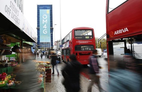 A billboard advertises 4G mobile telecom services of market leader EE, owned by France Telecom and Deutsche Telekom, at Elephant & Castle in A billboard advertises 4G mobile telecom services of market leader EE, owned by France Telecom and Deutsche Telekom, at Elephant & Castle in