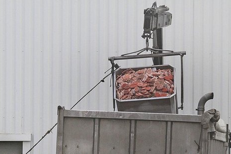 A dump truck is filled up with blocks of meat at French meat processor Spanghero's factory in Castelnaudary near Toulouse, southwestern Fran A dump truck is filled up with blocks of meat at French meat processor Spanghero's factory in Castelnaudary near Toulouse, southwestern Fran