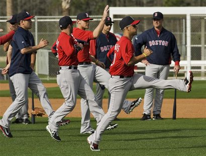 Boston Red Sox manager John Farrell (R) watches his players warm up during a workout at the team's MLB spring training complex in Fort Myers Boston Red Sox manager John Farrell (R) watches his players warm up during a workout at the team's MLB spring training complex in Fort Myers