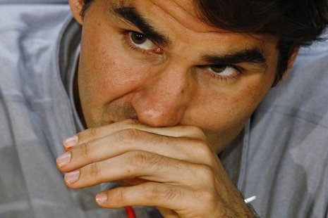 Roger Federer of Switzerland attends a news conference after he was defeated in his men's singles semi-final match by Andy Murray of Britain Roger Federer of Switzerland attends a news conference after he was defeated in his men's singles semi-final match by Andy Murray of Britain