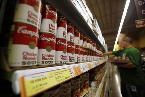 A worker restocks Campbell's soup cans inside a Fresh & Easy store in Burbank, California October 19, 2012. Picture taken October 19, 2012. A worker restocks Campbell's soup cans inside a Fresh & Easy store in Burbank, California October 19, 2012. Picture taken October 19, 2012.