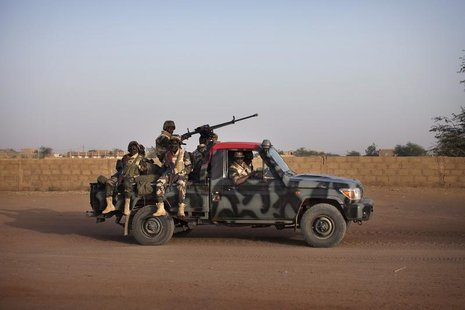 Malian soldiers patrol the streets of Gao February 20, 2013. REUTERS/Joe Penney Malian soldiers patrol the streets of Gao February 20, 2013. REUTERS/Joe Penney