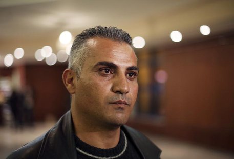 Palestinian journalist Emad Burnat pauses while he speaks to members of the media before a screening of his Oscar-nominated documentary "5 B Palestinian journalist Emad Burnat pauses while he speaks to members of the media before a screening of his Oscar-nominated documentary "5 B