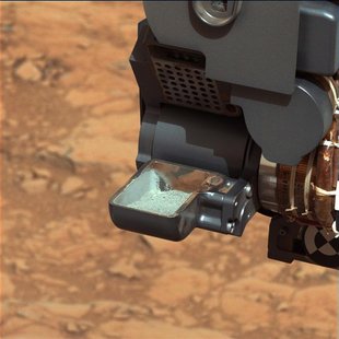 The first sample of powdered rock from Mars extracted by the NASA's Curiosity rover drill is pictured in this February 20, 2013 NASA handout The first sample of powdered rock from Mars extracted by the NASA's Curiosity rover drill is pictured in this February 20, 2013 NASA handout
