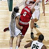 Indiana's Will Sheehey (0) shoots against Michigan State's Travis Trice (20) as Derrick Nix (25) and Denzel Valentine watch during the first half of an NCAA college basketball game, Tuesday, Feb. 19, 2013, in East Lansing, Mich. (AP Photo/Al Goldis) 