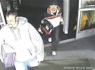 This surveillance photo shows two men suspected of stealing electronics from Best Buy in Oshkosh, Feb. 18, 2013. This surveillance photo shows two men suspected of stealing electronics from Best Buy in Oshkosh, Feb. 18, 2013.