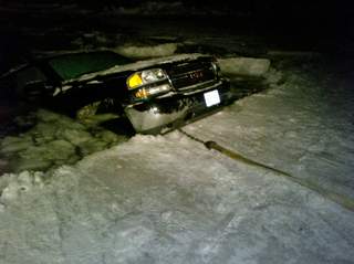 Truck falls through the ice on Lake Winnebago. (courtesy of FOX 11). Truck falls through the ice on Lake Winnebago. (courtesy of FOX 11).