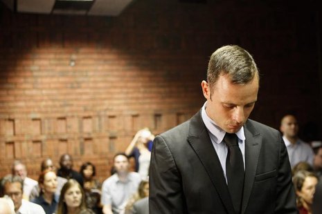 Oscar Pistorius stands in the dock during a break in court proceedings at the Pretoria Magistrates court, February 20, 2013. REUTERS/Siphiwe Oscar Pistorius stands in the dock during a break in court proceedings at the Pretoria Magistrates court, February 20, 2013. REUTERS/Siphiwe