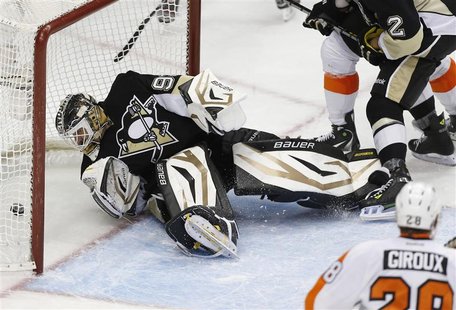 Pittsburgh Penguins goalie Tomas Vokoun (L) watches a puck shot by Philadelphia Flyers Tomas Voracek (not seen) go into the net in the third Pittsburgh Penguins goalie Tomas Vokoun (L) watches a puck shot by Philadelphia Flyers Tomas Voracek (not seen) go into the net in the third