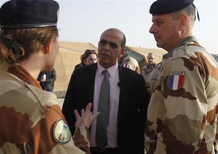 French Minister for Veteran Affairs Kader Arif (C) speaks to members of a French military field hospital at the Al Zaatri refugee camp in th French Minister for Veteran Affairs Kader Arif (C) speaks to members of a French military field hospital at the Al Zaatri refugee camp in th