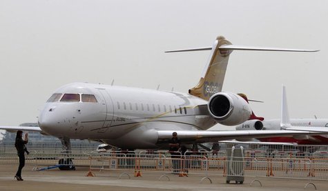 Visitors take photos in front of a Bombardier Global 6000 commercial plane at the China International Aviation & Aerospace Exhibition in the Visitors take photos in front of a Bombardier Global 6000 commercial plane at the China International Aviation & Aerospace Exhibition in the