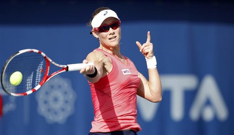Samantha Stosur of Australia hits a return to Roberta Vinci of Italy during their women's singles quarter-final match at the WTA Dubai Tenni Samantha Stosur of Australia hits a return to Roberta Vinci of Italy during their women's singles quarter-final match at the WTA Dubai Tenni