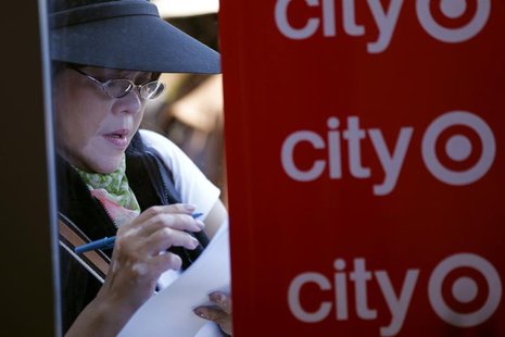 A woman fills out an application for one of the 300 available positions at a new Target retail store in San Francisco, California August 9, A woman fills out an application for one of the 300 available positions at a new Target retail store in San Francisco, California August 9,
