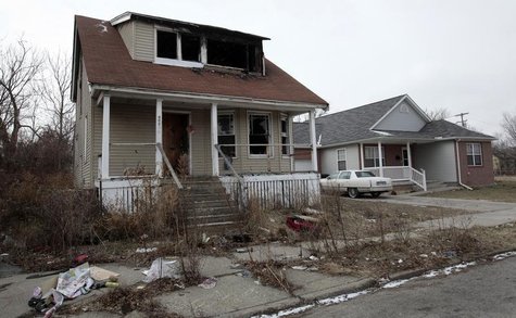 A vacant and blighted house sits next to a well-kept occupied house in a once thriving eastside neighborhood in Detroit, Michigan January 23 A vacant and blighted house sits next to a well-kept occupied house in a once thriving eastside neighborhood in Detroit, Michigan January 23