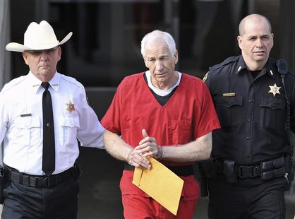 Jerry Sandusky (C) leaves the Centre County Courthouse after his sentencing in his child sex abuse case in Bellefonte, Pennsylvania October Jerry Sandusky (C) leaves the Centre County Courthouse after his sentencing in his child sex abuse case in Bellefonte, Pennsylvania October