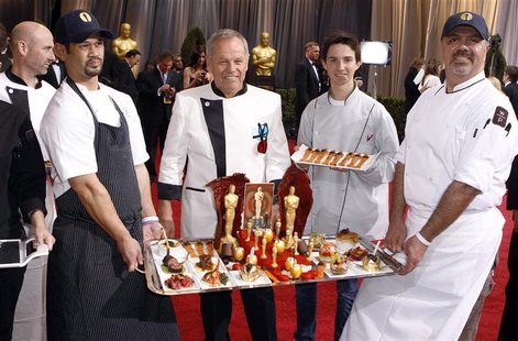 Celebrity chef Wolfgang Puck (C) and his staff display their Oscar creations on the red carpet at the 84th Academy Awards in Hollywood, Cali Celebrity chef Wolfgang Puck (C) and his staff display their Oscar creations on the red carpet at the 84th Academy Awards in Hollywood, Cali