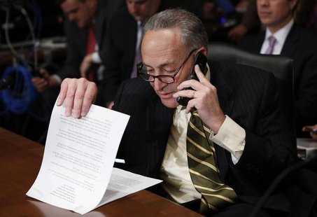 U.S. Senator Charles Schumer looks through his prepared remarks before introducing Jack Lew, U.S. President Barack Obama's nominee to lead t U.S. Senator Charles Schumer looks through his prepared remarks before introducing Jack Lew, U.S. President Barack Obama's nominee to lead t