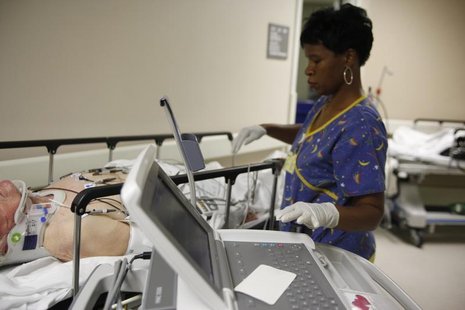 EKG technician Diana Goodie (R) performs an electrocardiogram on a patient in the hallway of the emergency room at Ben Taub General Hospital EKG technician Diana Goodie (R) performs an electrocardiogram on a patient in the hallway of the emergency room at Ben Taub General Hospital