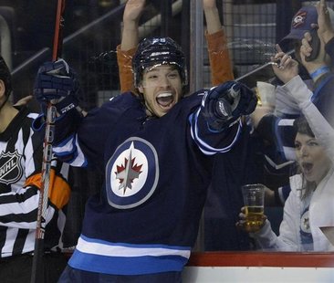 Winnipeg Jets' Zach Redmond celebrates his goal against the Toronto Maple Leafs during the second period of their NHL hockey game in Winnipe Winnipeg Jets' Zach Redmond celebrates his goal against the Toronto Maple Leafs during the second period of their NHL hockey game in Winnipe