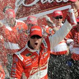 Kevin Harvick celebrates in the victory lane with his crew after winning the first NASCAR Sprint Cup Series Budweiser Duel at the Daytona In Kevin Harvick celebrates in the victory lane with his crew after winning the first NASCAR Sprint Cup Series Budweiser Duel at the Daytona In
