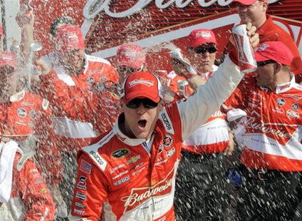Kevin Harvick celebrates in the victory lane with his crew after winning the first NASCAR Sprint Cup Series Budweiser Duel at the Daytona In Kevin Harvick celebrates in the victory lane with his crew after winning the first NASCAR Sprint Cup Series Budweiser Duel at the Daytona In