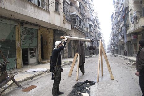 A Free Syrian Army fighter holds an improvised catapult in Aleppo's district of Salaheddine February 19, 2013. REUTERS/Abdalghne Karoof A Free Syrian Army fighter holds an improvised catapult in Aleppo's district of Salaheddine February 19, 2013. REUTERS/Abdalghne Karoof
