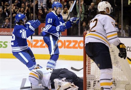 Toronto Maple Leafs Tyler Bozak (L) and teammate James van Riemsdyk (2nd L) celebrate van Riemsdyk's goal near Buffalo Sabres goalie Ryan Mi Toronto Maple Leafs Tyler Bozak (L) and teammate James van Riemsdyk (2nd L) celebrate van Riemsdyk's goal near Buffalo Sabres goalie Ryan Mi