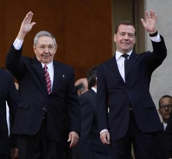 Russia's Prime Minister Dmitry Medvedev and Cuban President Raul Castro (L) wave at the entrance of the Revolution Palace in Havana, Februar Russia's Prime Minister Dmitry Medvedev and Cuban President Raul Castro (L) wave at the entrance of the Revolution Palace in Havana, Februar