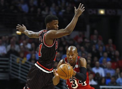 Miami Heat's Ray Allen (R) steals a pass intended for Chicago Bulls' Jimmy Butler during the first half of their NBA basketball game in Chic Miami Heat's Ray Allen (R) steals a pass intended for Chicago Bulls' Jimmy Butler during the first half of their NBA basketball game in Chic