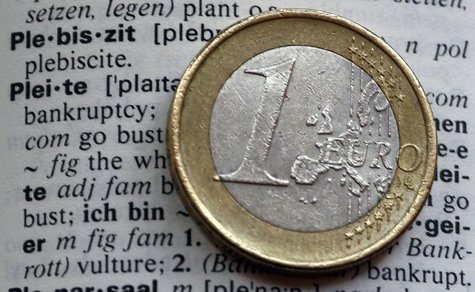 An one Euro coin is pictured next to the words bankruptcy (pleite) in an English-German dictionary in Munich February 10, 2012. REUTERS/Mich An one Euro coin is pictured next to the words bankruptcy (pleite) in an English-German dictionary in Munich February 10, 2012. REUTERS/Mich
