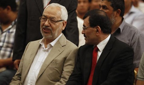 Ennahda movement leader Rachid Ghannouchi (L) speaks with Tunisian Interior Minister Ali Larayedh during the 2nd national congress of the Co Ennahda movement leader Rachid Ghannouchi (L) speaks with Tunisian Interior Minister Ali Larayedh during the 2nd national congress of the Co