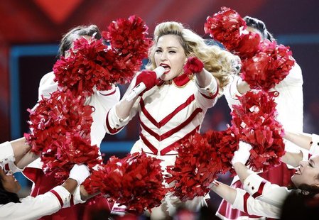 Singer Madonna performs at Staples Center as part of her MDNA world tour in Los Angeles, California October 10, 2012. REUTERS/Mario Anzuoni Singer Madonna performs at Staples Center as part of her MDNA world tour in Los Angeles, California October 10, 2012. REUTERS/Mario Anzuoni