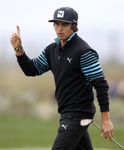 Rickie Fowler of the U.S. reacts on the 9th green as his birdie putt misses against Carl Pettersson of Sweden during the weather delayed fir Rickie Fowler of the U.S. reacts on the 9th green as his birdie putt misses against Carl Pettersson of Sweden during the weather delayed fir