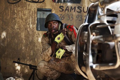 A Malian soldier looks on during fighting with Islamists in Gao, February 21, 2013. REUTERS/Joe Penney A Malian soldier looks on during fighting with Islamists in Gao, February 21, 2013. REUTERS/Joe Penney