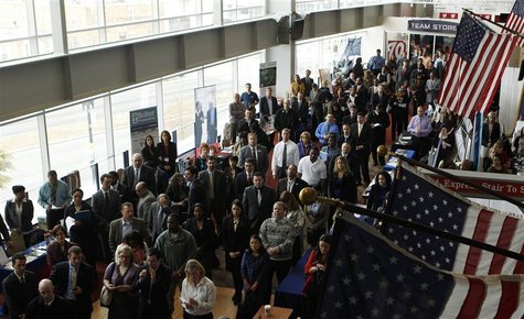 Job applicants listen to a presentation prior to the opening of a job fair for veterans and their spouses held by the U.S. Chamber of Commer Job applicants listen to a presentation prior to the opening of a job fair for veterans and their spouses held by the U.S. Chamber of Commer