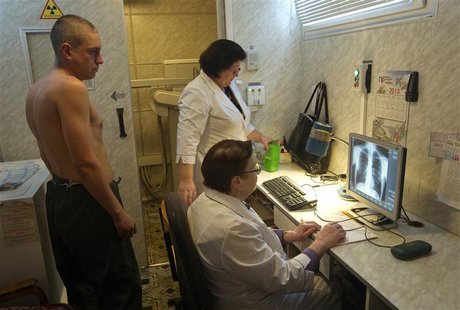 A man (L) is x-rayed to detect tuberculosis during a medical examination, organized by the Belarusian Red Cross society, in Minsk, January 2 A man (L) is x-rayed to detect tuberculosis during a medical examination, organized by the Belarusian Red Cross society, in Minsk, January 2