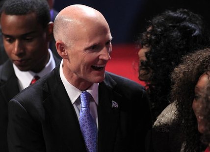 Florida Governor Rick Scott greets an attendee in the audience before the start of the final U.S. presidential debate between Republican pre Florida Governor Rick Scott greets an attendee in the audience before the start of the final U.S. presidential debate between Republican pre