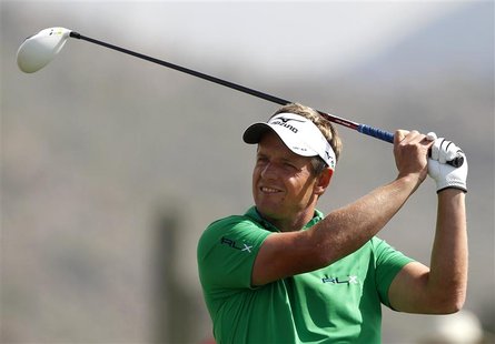 Luke Donald of England watches his tee shot on the second hole during the second round of the WGC-Accenture Match Play Championship golf tou Luke Donald of England watches his tee shot on the second hole during the second round of the WGC-Accenture Match Play Championship golf tou