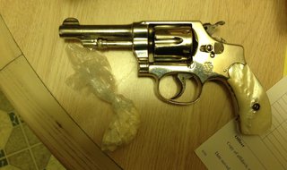 Drugs and firearms were found at the residence. Drugs and firearms were found at the residence.