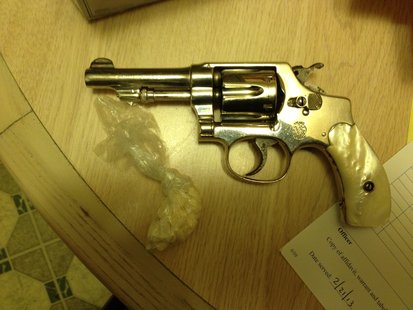Drugs and firearms were found at the residence. Drugs and firearms were found at the residence.