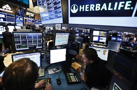 Traders work at the post that trades Herbalife stock on the floor of the New York Stock Exchange in this January 10, 2013 file photograph. R Traders work at the post that trades Herbalife stock on the floor of the New York Stock Exchange in this January 10, 2013 file photograph. R