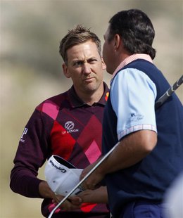 Ian Poulter (L) of England shakes hands with Bo Van Pelt of the U.S. on the 17th hole after their second round match of the WGC-Accenture Ma Ian Poulter (L) of England shakes hands with Bo Van Pelt of the U.S. on the 17th hole after their second round match of the WGC-Accenture Ma