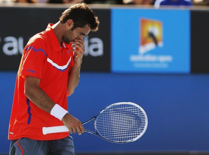 Marin Cilic of Croatia reacts during his men's singles match against Andreas Seppi of Italy at the Australian Open tennis tournament in Melb Marin Cilic of Croatia reacts during his men's singles match against Andreas Seppi of Italy at the Australian Open tennis tournament in Melb
