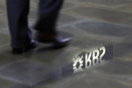 A man walks past a Royal Bank of Scotland branch reflected in a puddle in central London January 14, 2010. REUTERS/Stefan Wermuth A man walks past a Royal Bank of Scotland branch reflected in a puddle in central London January 14, 2010. REUTERS/Stefan Wermuth